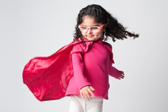 A child dressed like a superhero