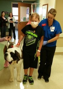 Luke Edmunds in animal-assisted physical therapy