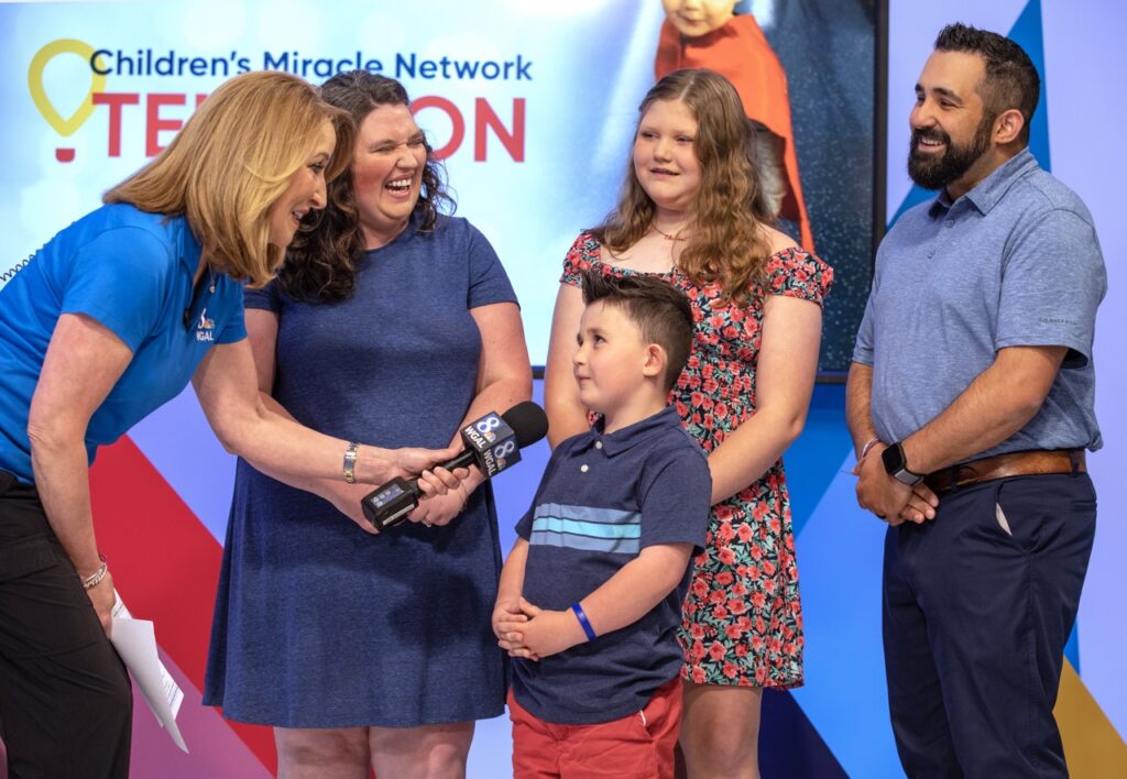 WGAL-TV anchor Lori Burkholder talks with the family of Children's Miracle Network child Kenny Baranowski during the CMN Telethon on Thursday, June 8, 2023.