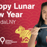 Girl eating noodles. Text reads Happy Lunar Year #PandaLNY