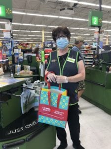 Rocklin Walmart employee poses with UC Davis Children's Hospital bag.