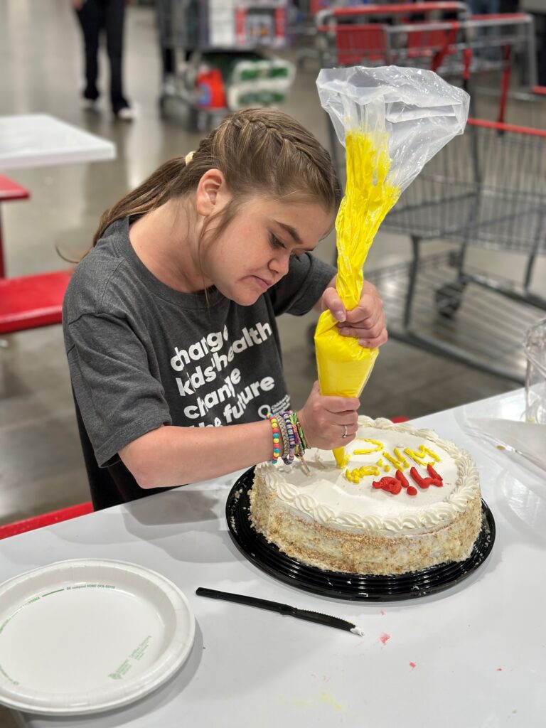 Mia hard at work decorating her cake